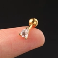 Macro detail of gold teardrop zircon cartilage stud earring held on a fingertip - Style 6 / Gold