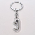 Detailed view of polished silver alloy metal keychain with a 3D letter J pendant - Letter J / Silver