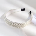 Baroque style pearl headband for women featuring dense white pearls with soft lighting - Mixed Size Cross Pearl Headband