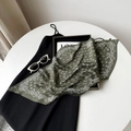 Detailed close-up of dark green pleated satin scarf with white paisley patterns - Army Green (Paisley)