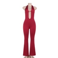 Detailed close-up of dark red halter neck jumpsuit with deep V-neckline and hollow out design - S / Burgundy