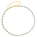 Detailed view of gold necklace with turquoise rectangular beads and sparkling zircon stones - Peacock Blue Necklace