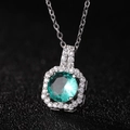 Silver necklace with a round green emerald pendant surrounded by white crystals - Light Green Pendant Only (Without Chain)