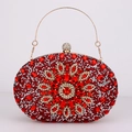 Detail of red rhinestone evening bag with floral crystal pattern and gold metal handle - Red