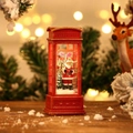 Rote Weihnachtslaterne in Telefonzellenform mit Weihnachtsmann und funkelndem Schnee - Rote Telefonzelle Weihnachtsmann