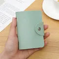 Mint green card holder with lychee texture and silver snap button closure - 24 Slots / RFID Green