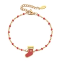 Detail of a gold stainless steel bracelet with red beads and a festive Christmas sock charm - Red