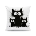 Detail shot of the white pillow cover featuring quirky hand-drawn black cat prints - Three Kittens