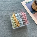 Five pastel elastic hair ties in a clear square acrylic box on a stylish gray fabric - 7# Macaron Spiral (50pcs Box)