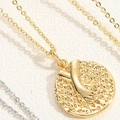 Macro detail of 14K gold plated medallion necklace with hand holding relief pendant - Holding Hands Relief Necklace
