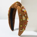 Detail of brown knit Easter headband with colorful beads, rhinestones, and rabbit charms - Yellow Zircon