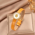 Detail of yellow crocodile pattern leather strap bracelet with sparkling clover emblem - Orange