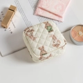 Quilted fabric storage pouch in cream white featuring cute bear pattern and zip closure - Quilted Bear