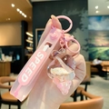 Pink seashell liquid oil keychain with sand bottle and soft silicone wristlet strap - Pink (Strap Style)