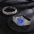 Close-up of luxury silver iced out watch with blue dial and matching cuban bracelet - Silver / Blue Watch + Bracelet