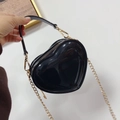 Close-up of black heart jelly bag with glossy finish and gold chain strap handle - Black / 14-5-11cm