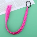 Close-up of pink braided hair extension with elastic band on turquoise background - Purplish Red