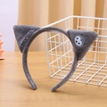 Close-up of gray plush cat ear headband featuring embroidered logo and owl character - Gray Cat