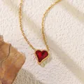 Detail of a gold heart pendant necklace featuring a large deep red gemstone and link chain - Deep Red Heart Style (BD021-red)
