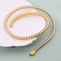 Polished gold tennis necklace with sparkling white zircons coiled on a tray - Gold Tone Large Style (N0123g-50) / Gold