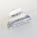 Close-up of silver metal hair claw clip featuring a brushed texture and shark tooth design - Silver Brushed Metal Hair Claw