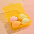 Set of 4 soft makeup sponges in various yellow tones within a transparent storage box - 4Pcs Makeup Sponges [Yellow]