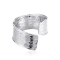 Macro view of wide silver open ring with irregular bark-like texture and industrial style - Silver