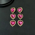 Orecchini pendenti a triplo cuore rosa con cristalli e finitura dorata di moda - Oro