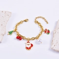 Christmas charm bracelet with Santa, tree and bell pendants on a gold chain link - Bracelet
