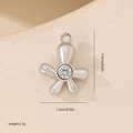 Detailed view of flower zircon pendant showing dimensions 1.4cm by 1.2cm and 2.3g weight - Flower Style White Gold (MYYX00671)