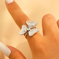 Polished silver leaf flower ring with radial texture on a woman's finger - Steel (A-862)