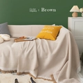 Cozy brown knitted sofa cover with fringe tassels displayed in a Nordic living room - 230*340cm / Coffee