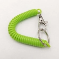 Green plastic spiral spring keychain with metal lobster clasp and ring for secure attachment - Green