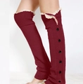 Close-up of burgundy knit leg warmers with black buttons and white lace trim detail - One Size / Wine Red