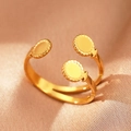 Detailed shot of bohemian gold adjustable ring with three serrated circular metal motifs - Gold Triple Disk (C1447)