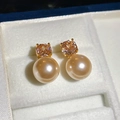 Detail of champagne gold pearl stud earrings with zircon inlay in a white jewelry box - Champagne Gold (S925 Silver Needle)