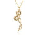 Macro shot of gold floral pendant with white zircon pavé on a thin cross chain necklace - E453-Pave Zirconia Spherical Flower