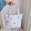 Detail of blue quilted tote bag with duck print and simple wish fabric label - Light Blue Striped Rabbit Small Handbag