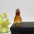 Mini amber glass wishing bottle pendant with cork stopper and silver DIY hanging loop - Champagne Oval Bottle With Eye Screw Cork