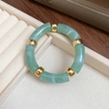 Green marble acrylic tube bracelet with golden metal spherical spacer beads - Green