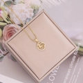 Detailed top view of 18K gold zodiac pendant with micro-inlaid diamonds on jewelry box - 1#Aries