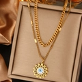 Detail of a double-layered gold necklace featuring a sunflower and evil eye pendant charm - Sunflower Evil Eye Style (N-36)