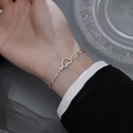 Silver-toned heart pendant bracelet featuring asymmetric chain links and a matte finish - Starry Heart Hollow Out Bracelet