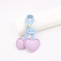 Close-up of heart-shaped leather cherry bag charm with purple fruit and blue leaves - Taro Purple