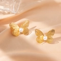 Golden butterfly stud earrings with hollowed-out wings and centered white pearls - Butterfly