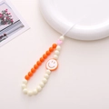 Orange and beige beaded phone charm with white smiley face pendant and pink heart accent - K1067 Smiley Phone Chain Orange