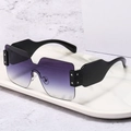 Fashionable oversized wrap-around sunglasses with purple gradient lenses on marble - Black Frame Double Gray Lens