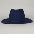 Detail of navy blue wool fedora hat featuring a black leather band and silver metal buckle - Navy Blue