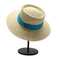 Detail of light beige boater hat showing fine straw weave and wide cyan ribbon - Beige + Lake Blue Ribbon