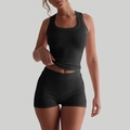 Women's black ribbed knit sports set featuring a racerback tank top and high waist shorts - S / Black